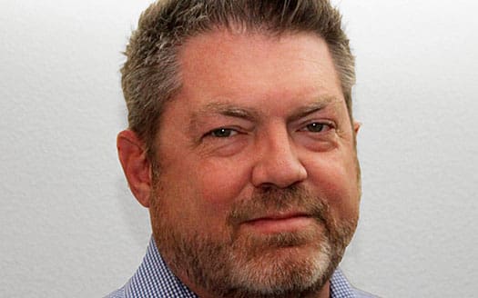 Headshot of a man with a beard.